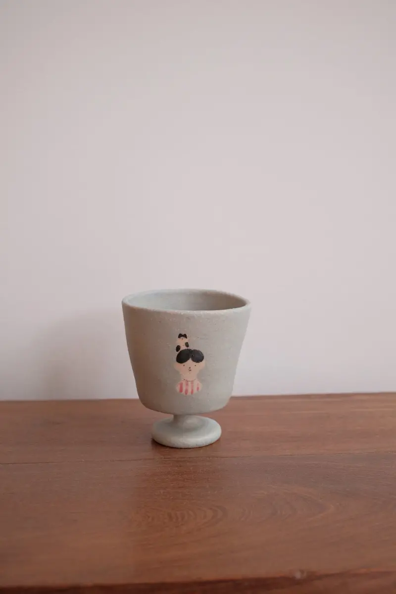 Aya Watanuki Bokkuri Pedestal Ceramic Cup – Blue Boy Illustration 1