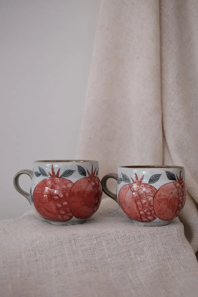 Curved Banana Belly Mug Featuring Pomegranate Motif 1